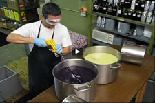 Herbaria employee making cold process soap