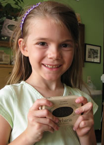 Erin McWilliams holding licorice soap bar
