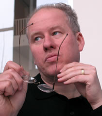 man holding glasses photo