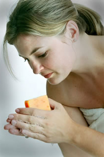 woman washing hands with soap