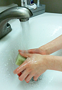 child washing hands
